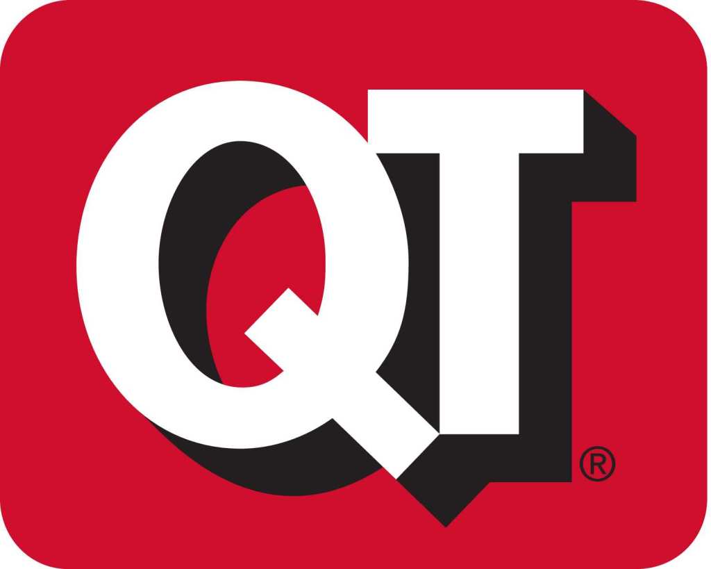 Logo of QT, featuring bold white letters 'QT' in a stylized font on a red background.